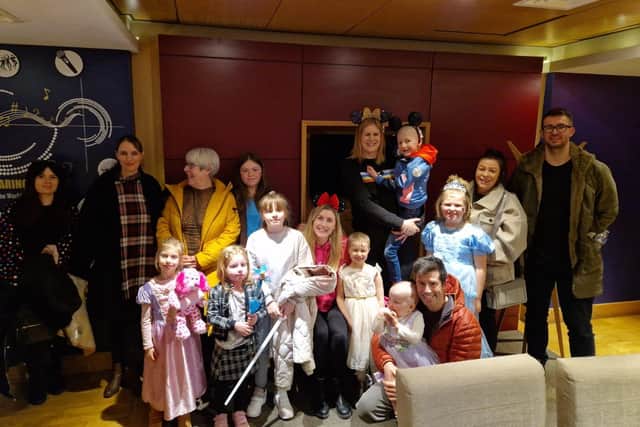 Families of Candlelighters visiting the private suit First Direct Arena for Disney On Ice. 