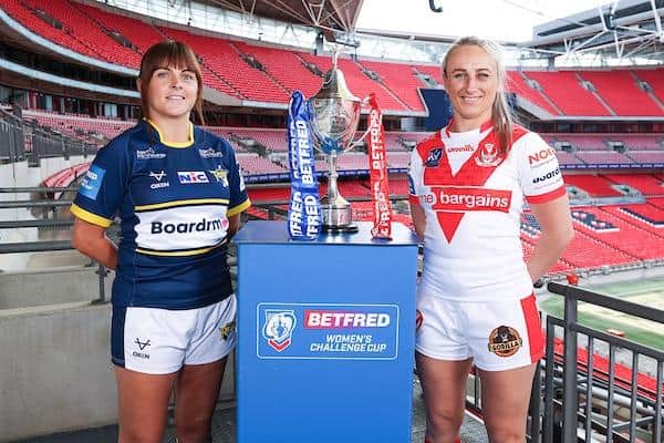 Rhinos' Hanna Butcher and Jodie Cunningham, of St Helens, with the Women's Challenge Cup at Wembley. Picture by Kieran Cleeves/SWpix.com.