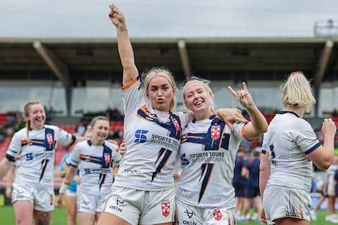 Keara Bennett, right, celebrates with Leeds Rhinos teammate Shona Hoyle following England's win over France at Toulouse in June. Picture by Alex Whitehead/SWpix.com.