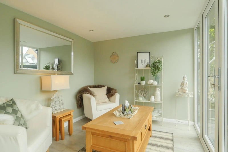 The dining room leads to a family room which in turn leads to a garden room, both ideal additional seating areas.