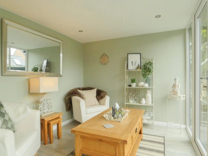 The dining room leads to a family room which in turn leads to a garden room, both ideal additional seating areas.