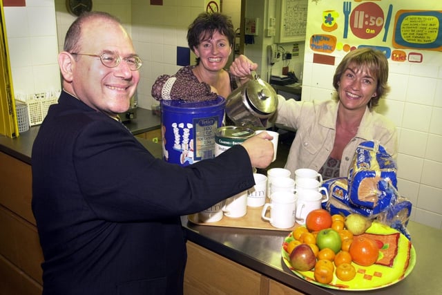 St Georges Crypt fundraising manager Martin Patterson raises his mug to Marie Morris and Janette Blythe, Barclays Bank community managers for the Yorkshire area, after the bank pledged £28,000 to pay for the charity's food bill.