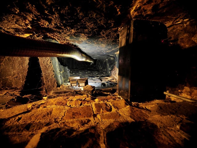 This Bardsey boozer boasts more than 1,000 years of history as well as an Inglenook fireplace, a Dutch oven, priest holes (pictured) and wooden beams.