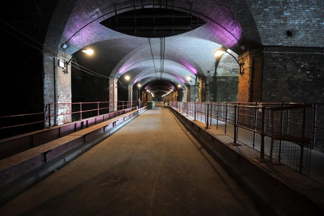 Based on Dark Neville Street, the landmark construction was apparently first built to support the Leeds City Station structure. The Dark Arches at Granary Wharf are a network of brick arches and the River Aire runs underneath and through them, according to Visit Leeds.