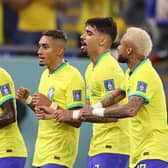 DOHA, QATAR - DECEMBER 05: Neymar of Brazil celebrates with Raphinha, Lucas Paqueta and Vinicius Junior after scoring the team's second goal via a penalty during the FIFA World Cup Qatar 2022 Round of 16 match between Brazil and South Korea at Stadium 974 on December 05, 2022 in Doha, Qatar. (Photo by Michael Steele/Getty Images)