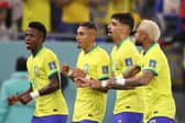 DOHA, QATAR - DECEMBER 05: Neymar of Brazil celebrates with Raphinha, Lucas Paqueta and Vinicius Junior after scoring the team's second goal via a penalty during the FIFA World Cup Qatar 2022 Round of 16 match between Brazil and South Korea at Stadium 974 on December 05, 2022 in Doha, Qatar. (Photo by Michael Steele/Getty Images)