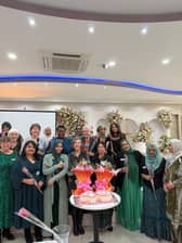 Asha staff and trustees celebrate 40 years’ service to the community with roses.