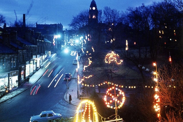 Christmas decorations in Scarth Gardens, Scatcherd Park, Scatcherd Hill and on Morley Town Hall taken just after dusk in December 1966. Headlights and tail lights of vehicles on Scatcherd Hill can be seen, whereas the outline of vehicles not moving can be seen in full light. Bulbs at a low level were subject to vandalism so, as time went by, the Christmas decorations were put at a higher level and even the Christmas trees on the Town Hall steps were abandoned.