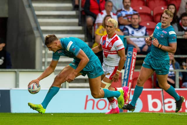 Sam Walters scores Rhinos' second try in the 22-18 loss at St Helens on Friday. Picture by Bruce Rollinson.