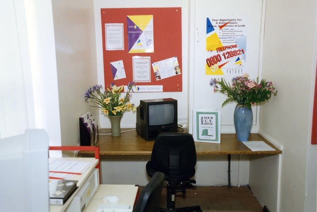 A view of the Open For Learning Centre in an alcove of the Commercial and Technical Library on the ground floor of Leeds Central, seen at the time of the launch of this service in April 1994. The service provided materials in different formats, including computer disks and videos, for work related learning. Topics included GCSE examination work, creative writing, computing and C.V. preparation. A 'Training Access Points' computer was also available with information on training courses.