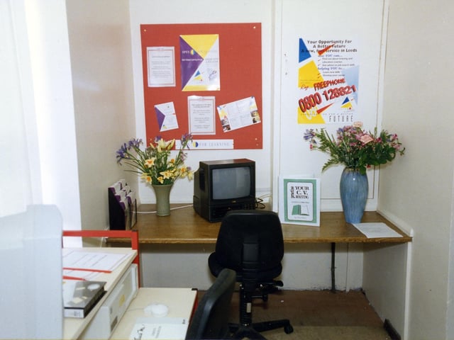 A view of the Open For Learning Centre in an alcove of the Commercial and Technical Library on the ground floor of Leeds Central, seen at the time of the launch of this service in April 1994. The service provided materials in different formats, including computer disks and videos, for work related learning. Topics included GCSE examination work, creative writing, computing and C.V. preparation. A 'Training Access Points' computer was also available with information on training courses.