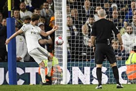Patrick Bamford shoots but misses as Leeds toil to a 1-1 draw with Leicester (Photo by OLI SCARFF/AFP via Getty Images)