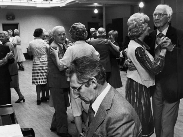 Couples waltz to the piano playing of Geoff Bell, at a tea dance at Ilkley's Winter Gardens in October 1979.