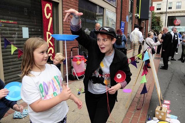 Rosie Kelly of Circus Leeds with Bea Stott, 8, working hard on circus skills.