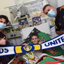 THUMBS UP: For Leeds United's Children's Hospital visit as Whites stars Brenden Aaronson, left, and Rasmus Kristensen, right, spread Festive cheer. Picture by LUFC.