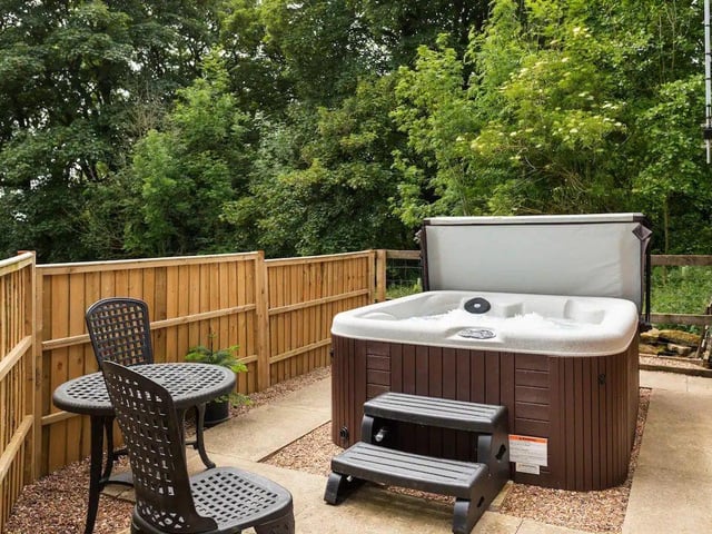 Located just outside the cabin is a private hot tub. Towels are provided.