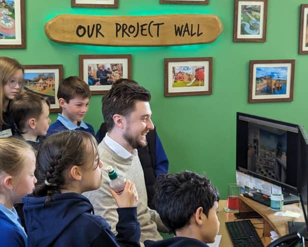 The children begin their design with Adam Press, Playscheme's head of design.