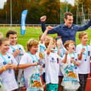 Alistair Bronwlee with kids taking part in one of their foundation triathlons.