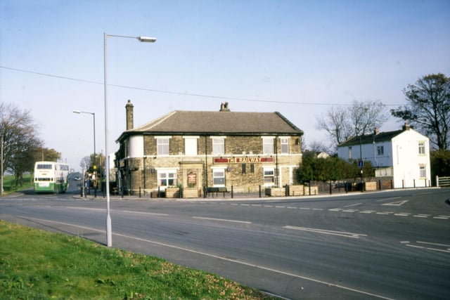 The Railway pub on Birstall Lane at Driglinghton. The road in the foreground is Station Road, while Birstall Lane leads off to the right and the road to the left of the pub into which a bus is travelling, is Moorside Road.