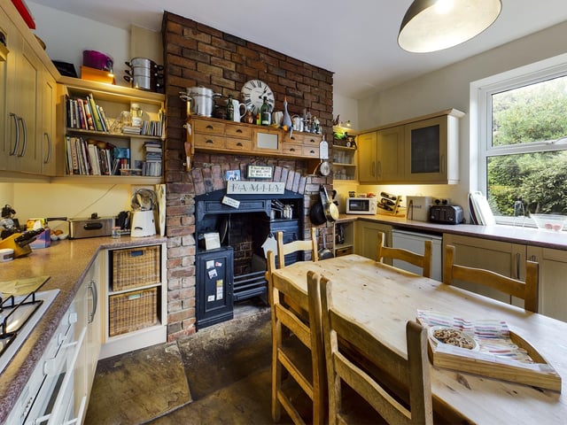 A homely kitchen environment with a Victorian stove.
