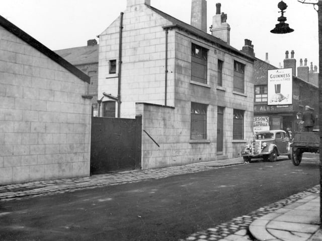 Little Russell Street and Coleman Street in September 1936. To the right can be seen Coleman Street, with a corner shop.