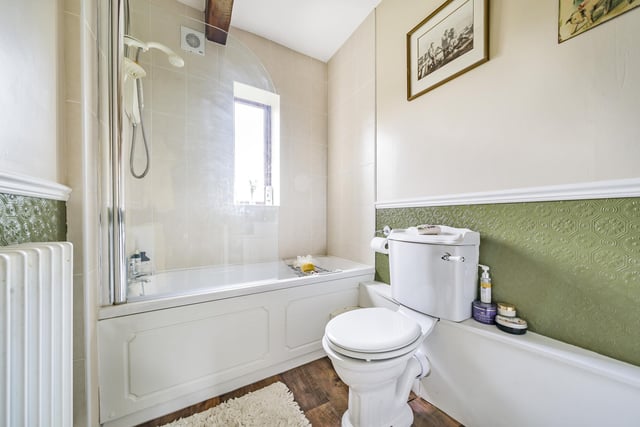 The bathroom has a tasteful three-piece suite including a bath with an over-head shower, toilet and hand basin. The features in keeping with a house of this period whilst being modern too. Picture: Linley and Simpson.