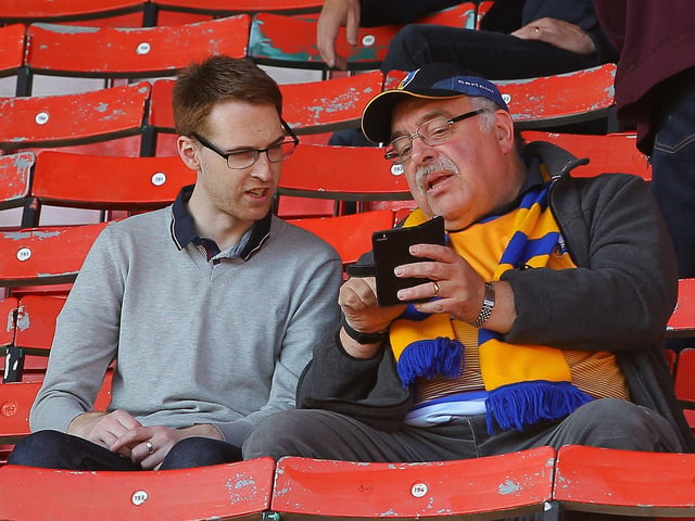 Craig Priest chats with his dad ahead of the game.