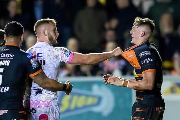 Leeds' Jarrod O'Connor, left, exchanges pleasantaries with former teammate Jack Broadbent, now of Castleford, during Thursday's derby at the Jungle. Picture by Allan McKenzie/SWpix.com.