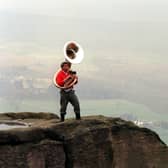 David Bray, playing On Ilkley Moor baht'at on his 80 year old sousaphone at the top of the Cow and Calf Rocks on Ilkley Moor to raise funds for Comic Relief. Pictured in March 1999.
