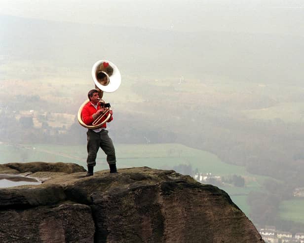 David Bray, playing On Ilkley Moor baht'at on his 80 year old sousaphone at the top of the Cow and Calf Rocks on Ilkley Moor to raise funds for Comic Relief. Pictured in March 1999.
