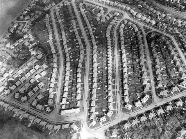 An aerial view of Carr Manor Housing Estate, a private suburban estate built in the 1950s by S.& N. Shute Ltd., Leeds who were one of the largest housebuilding companies in the north of England. It is located between Stonegate Road, top left, Scott Hall Road, top right and Stainbeck Road out of the picture below. Roads running up, from left, are:- Carr Manor Avenue, Carr Manor Road, Carr Manor Drive, Carr Manor Grove. Around the outside are Carr Manor View, top and right, Carr Manor Parade bottom right and Carr Manor Crescent bottom left.