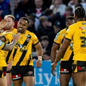 Jason Qareqare, facing camera, celebrates scoring for Castleford Tigers against Wakefield Trinity at Easter, but hasn't played since. Picture by Allan McKenzie/SWpix.com.