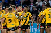 Jason Qareqare, facing camera, celebrates scoring for Castleford Tigers against Wakefield Trinity at Easter, but hasn't played since. Picture by Allan McKenzie/SWpix.com.