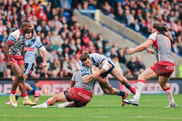 St Helens’ Louie McCarthy-Scarsbrook is tackled by Leigh’s John Asiata during last week's semi-final. Picture by Alex Whitehead/SWpix.com.