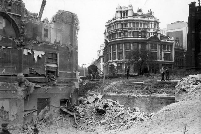 The demolition of the Royal Exchange Buildings at number 1A Park Row in May 1964. They were located on the east side of Park Row near City Square, at the junction with Boar Lane. They were replaced in 1965 by a tower block, Royal Exchange House, which has more recently been refurbished as the Park Plaza Hotel. In the background, right, is the Norwich Union Building in City Square. It dated from 1901 but was demolished to build a new Norwich Union