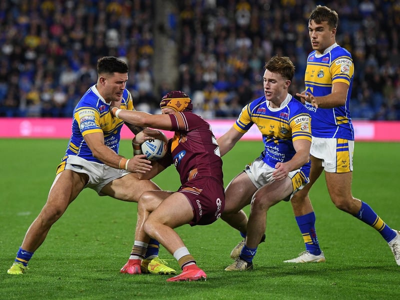 Rhinos conceded only 310 points in 27 league games, at an average of less than 11.5 per match. That was their best defensive effort in the competition's history. James Bentley is seen getting to grips with Huddersfield's George Flanagan as Ned McCormack and Presley Cassell close in.