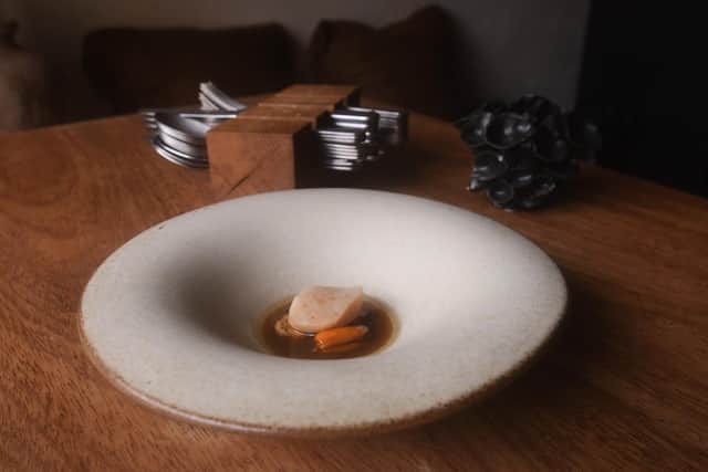 Chicken Fat Poached Scallop, Smoked Mussel and Chicken Wing Broth Picture taken by Yorkshire Post Photographer Simon Hulme