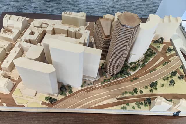 A model shows how the proposed new buildings - in brown - would fit into the city skyline.