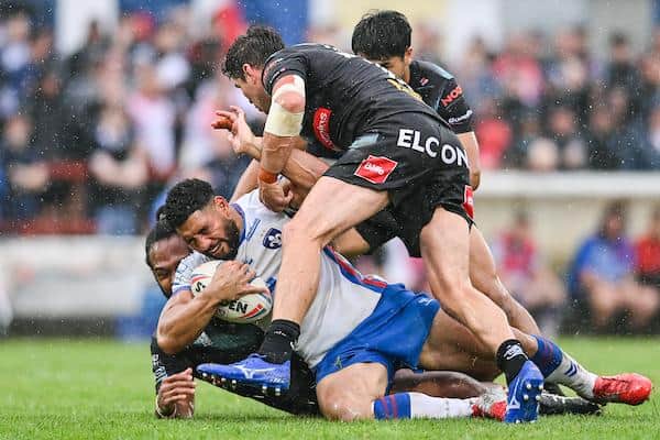 Wakefield's Kelepi Tanginoa is tackled by Louis McCarthy-Scarsbrook and Konrad Hurrell of St Helens. Picture by Will Palmer/SWpix.com.