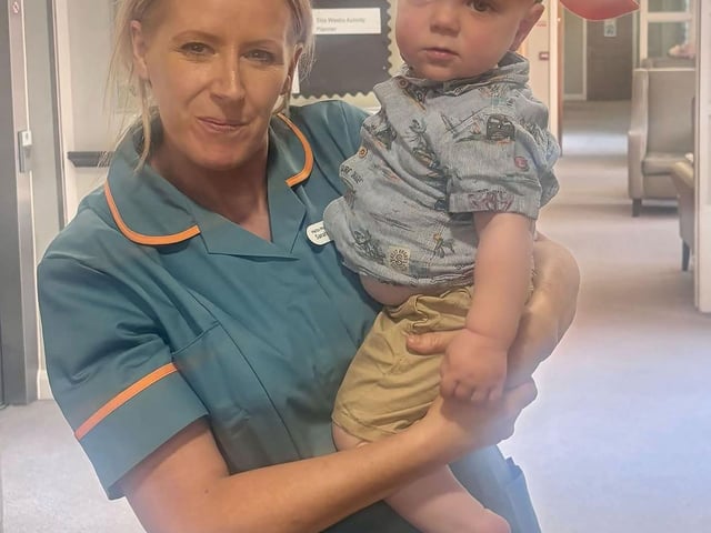 Colleague at HC-One’s Windsor Court Care Home with child from Hartbeeps Mums and Baby Group