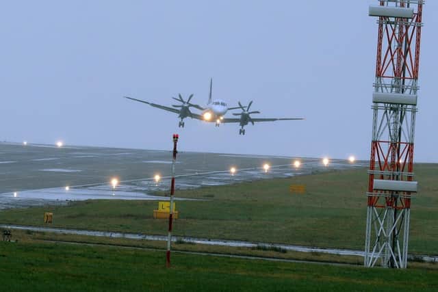 23 February 2017......   A plane lands at Leeds Bradford Airport before Storm Doris hits the area.
