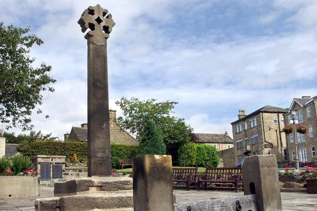 The Cross, ancient stocks and War Memorial Garden in August 2003.