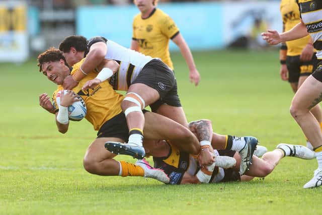 Krystian Mapapalangi is tackled by York Knights' Xavier Va'a during Castleford Tigers' defeat last week. Picture by Paul Currie/SWpix.com.