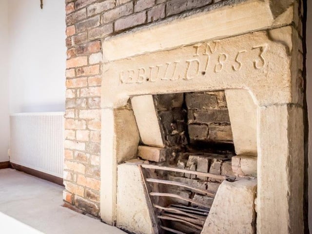 A lovely old fireplace within the property is one outstanding feature.