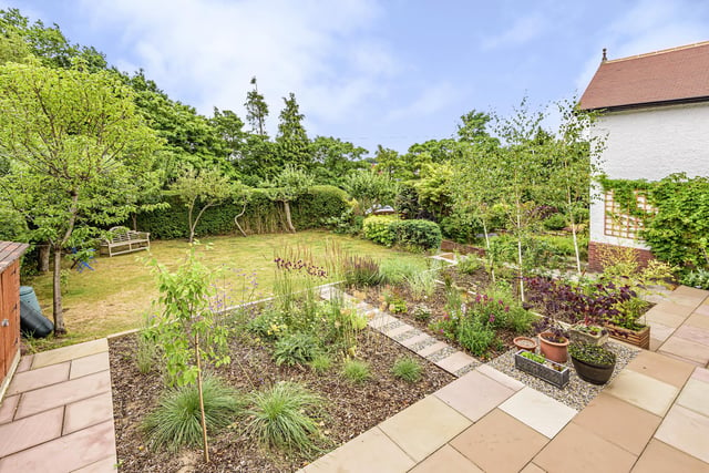 Outside are beautiful, landscaped gardens which have been carefully planned and designed and are larger than average for this area. The gardens are mainly laid to lawn with well stocked borders, flowers, shrubs and many fruit trees and two garden sheds with ample storage.