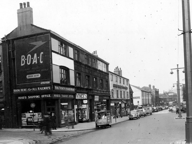 The corner of Park Lane and Park Cross Street pictured in April 1953. In focus are Moods Tourist Office, Vince's boot and shoe dealers and Yorkshire Training College of Music.