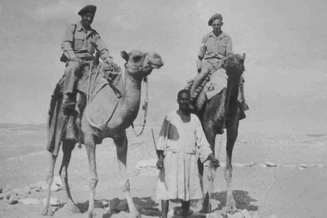 Alwyn (r) and Harry on camel, Egypt 1943