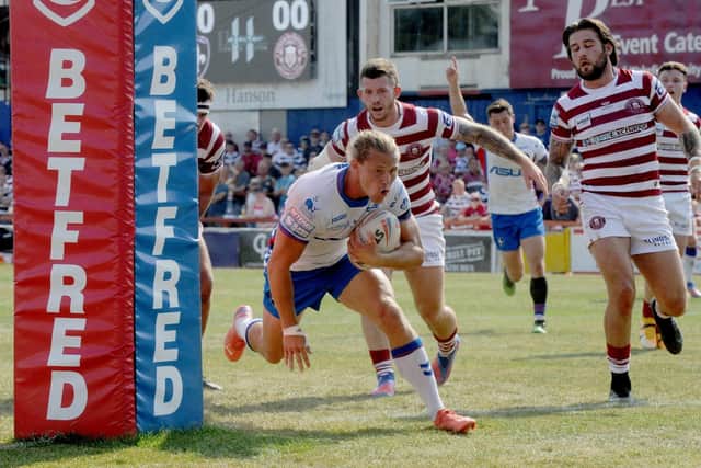 Jacob Miller goes over to score a try against Wigan Warriors. (Picture: Steve Riding)