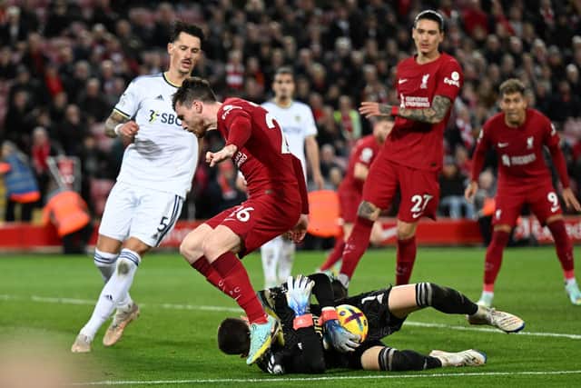 BRAVE: Whites goalkeeper Illan Meslier smothers the ball under pressure from Andy Robertson as part of a superb display that was crucial to Saturday night's memorable 2-1 win against Liverpool at Anfield. Photo by Andrew Powell/Liverpool FC via Getty Images.