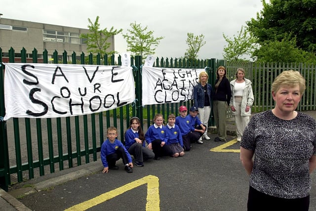 Parent governor Judith Monaghan, front, is pictured with parents and pupils during their protest over the proposed closure of Aireview Primary School.